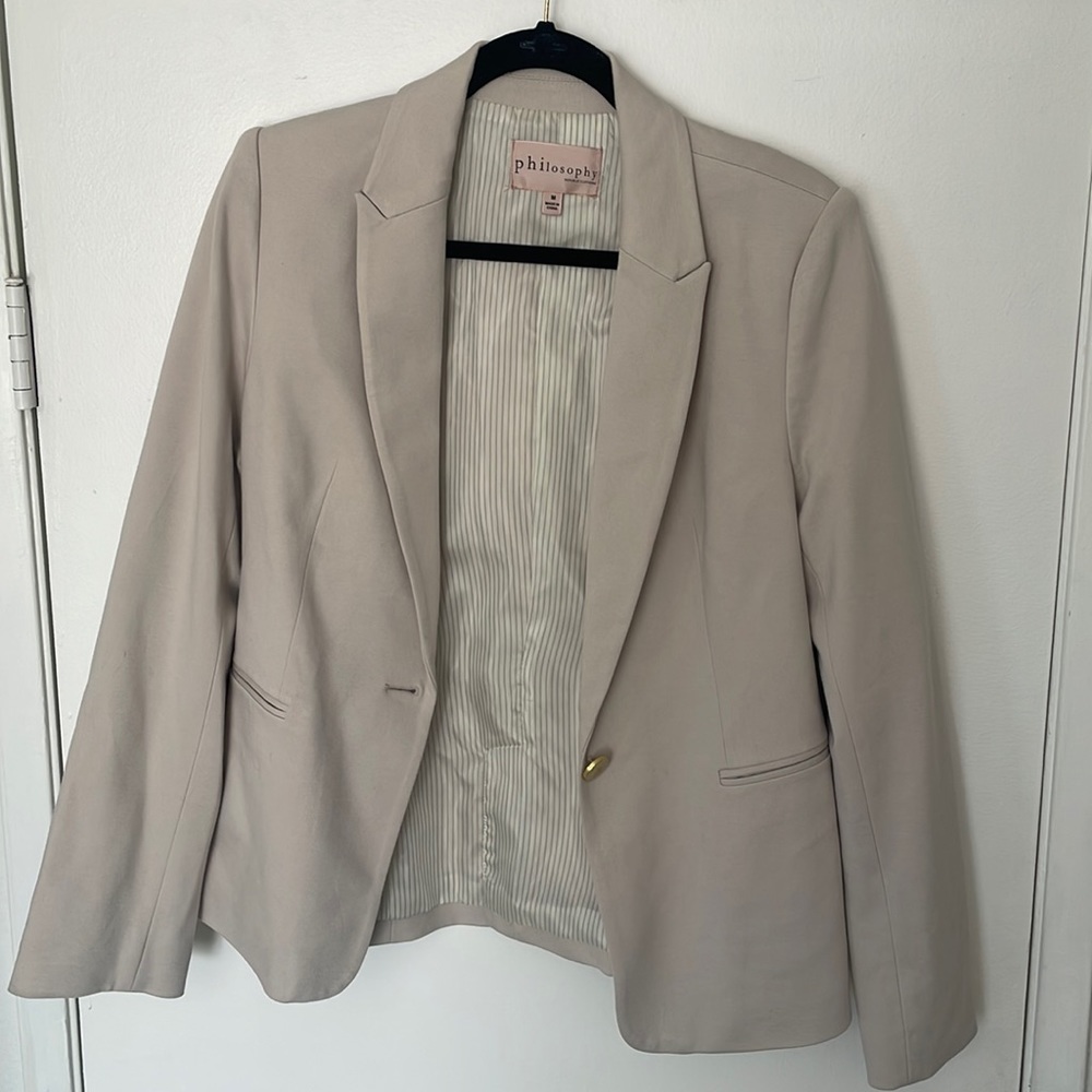 Cream Philosophy blazer is size medium.